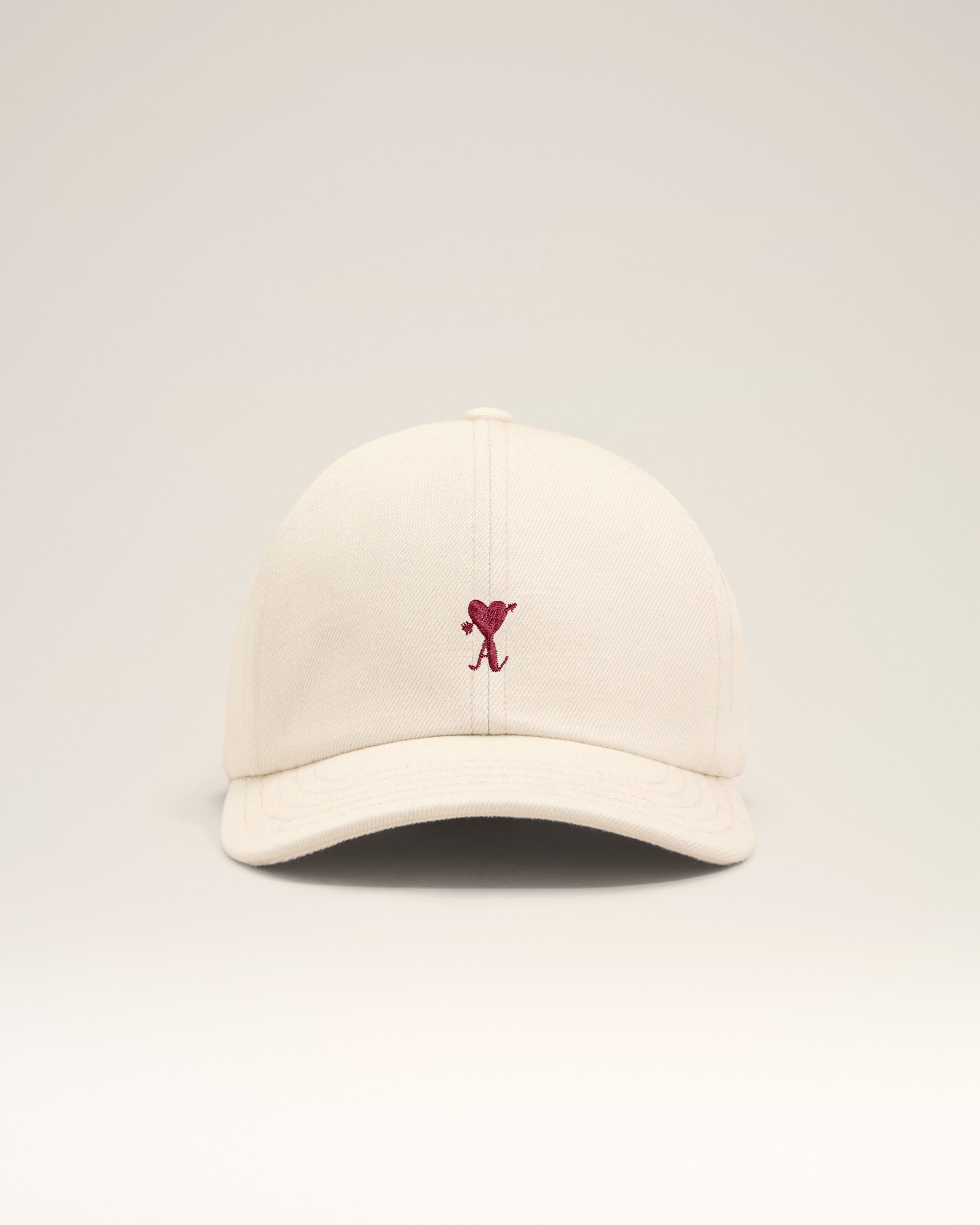 White cotton cap with heart arrow