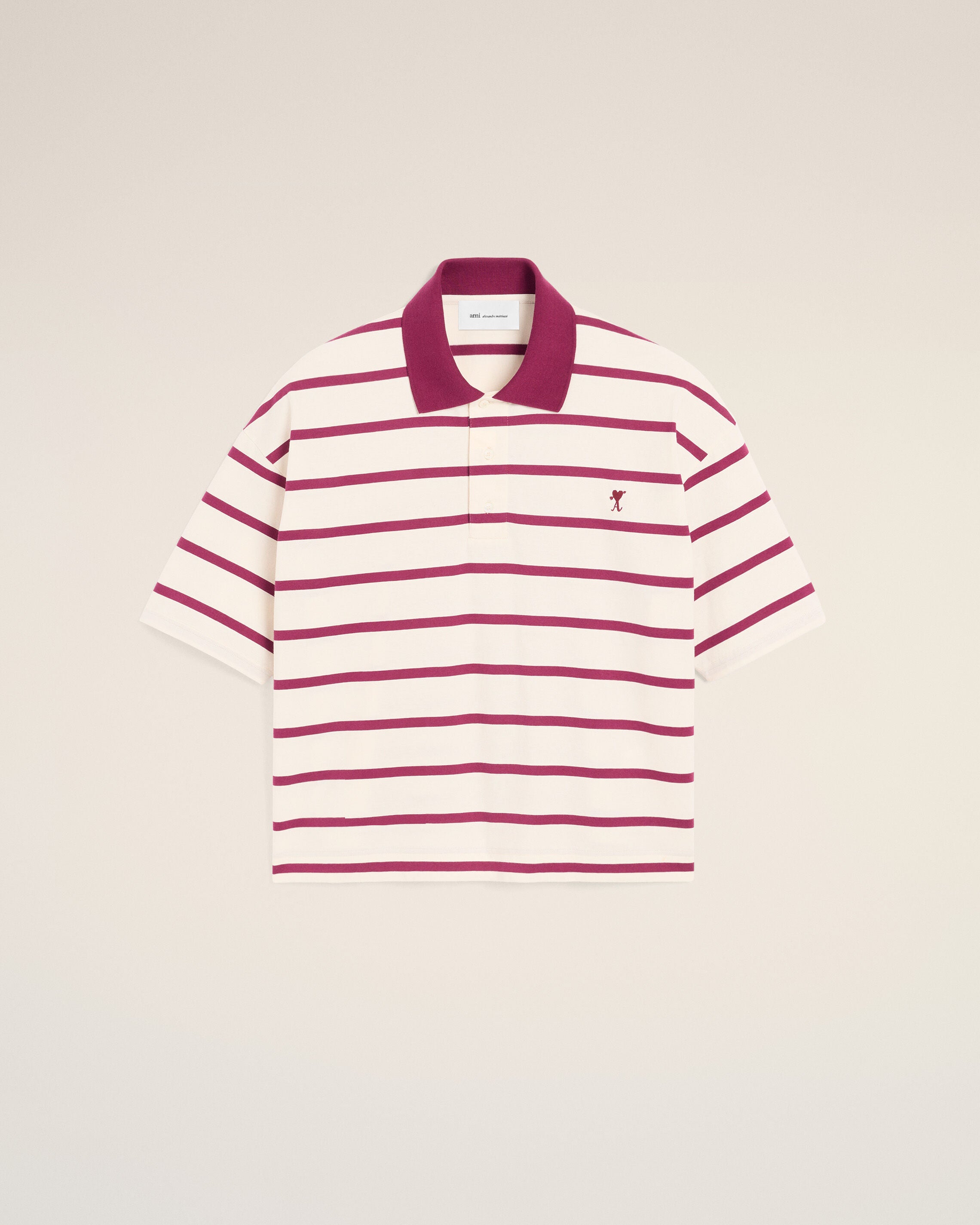 White cotton polo with heart arrow
