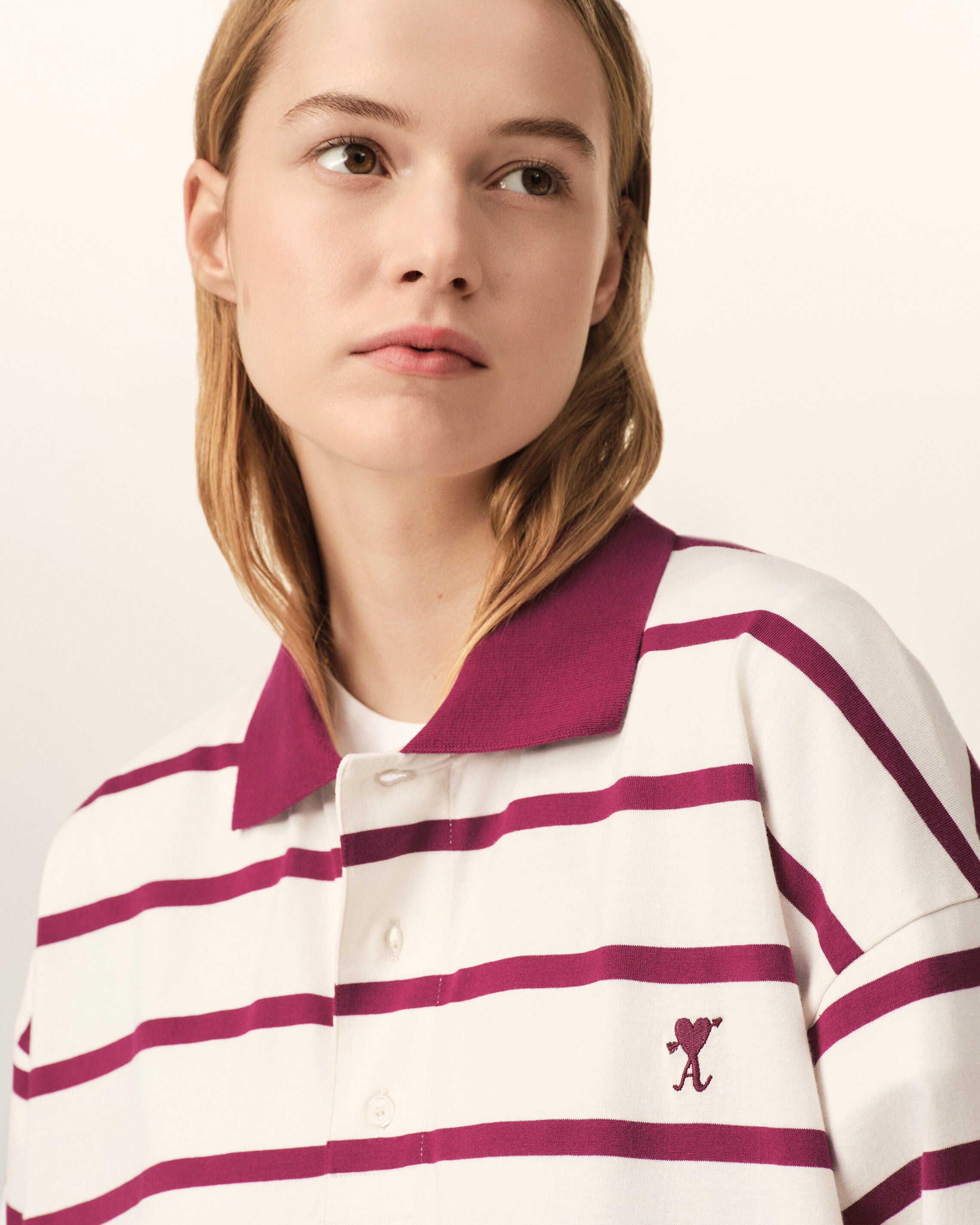 White cotton polo with heart arrow