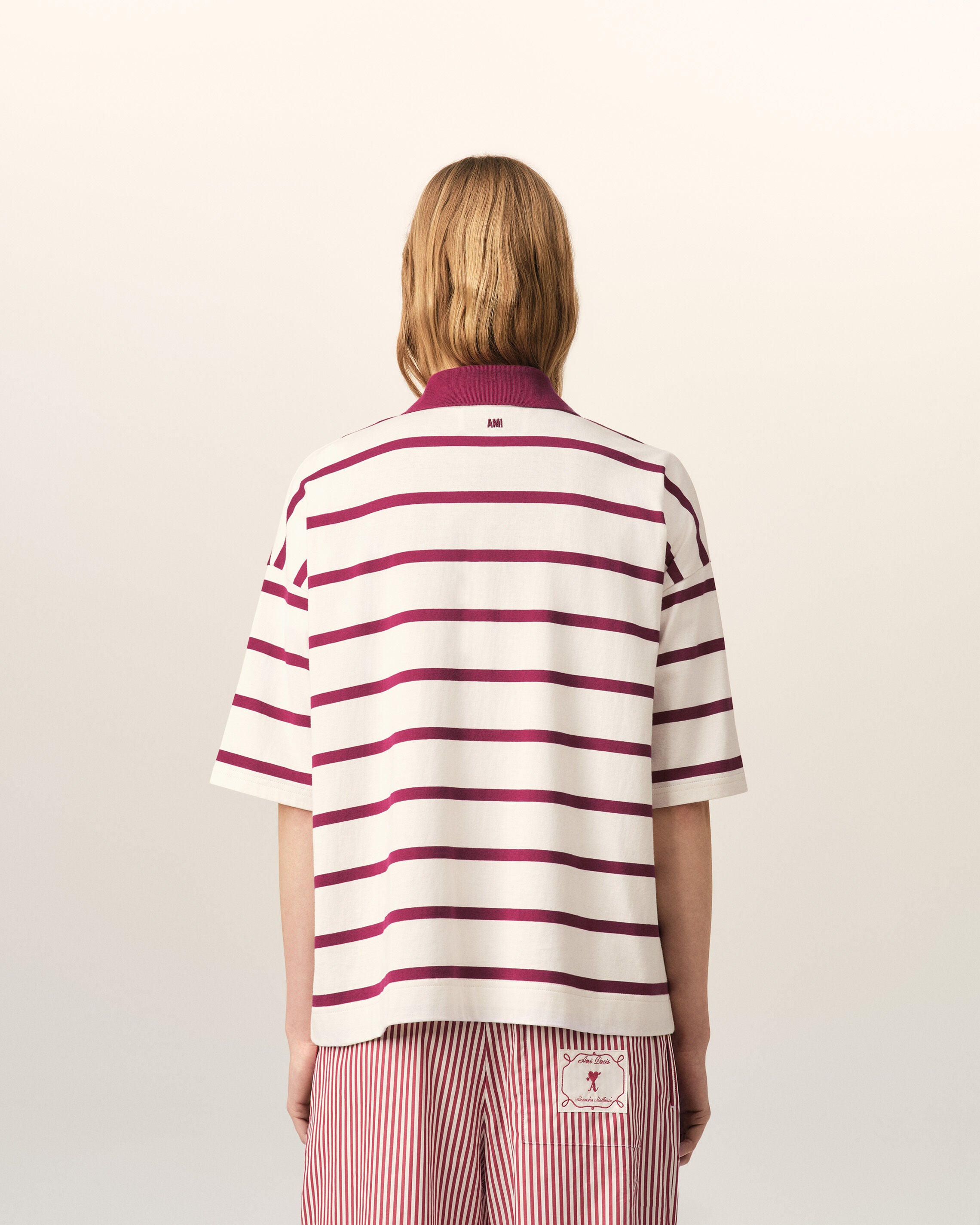 White cotton polo with heart arrow