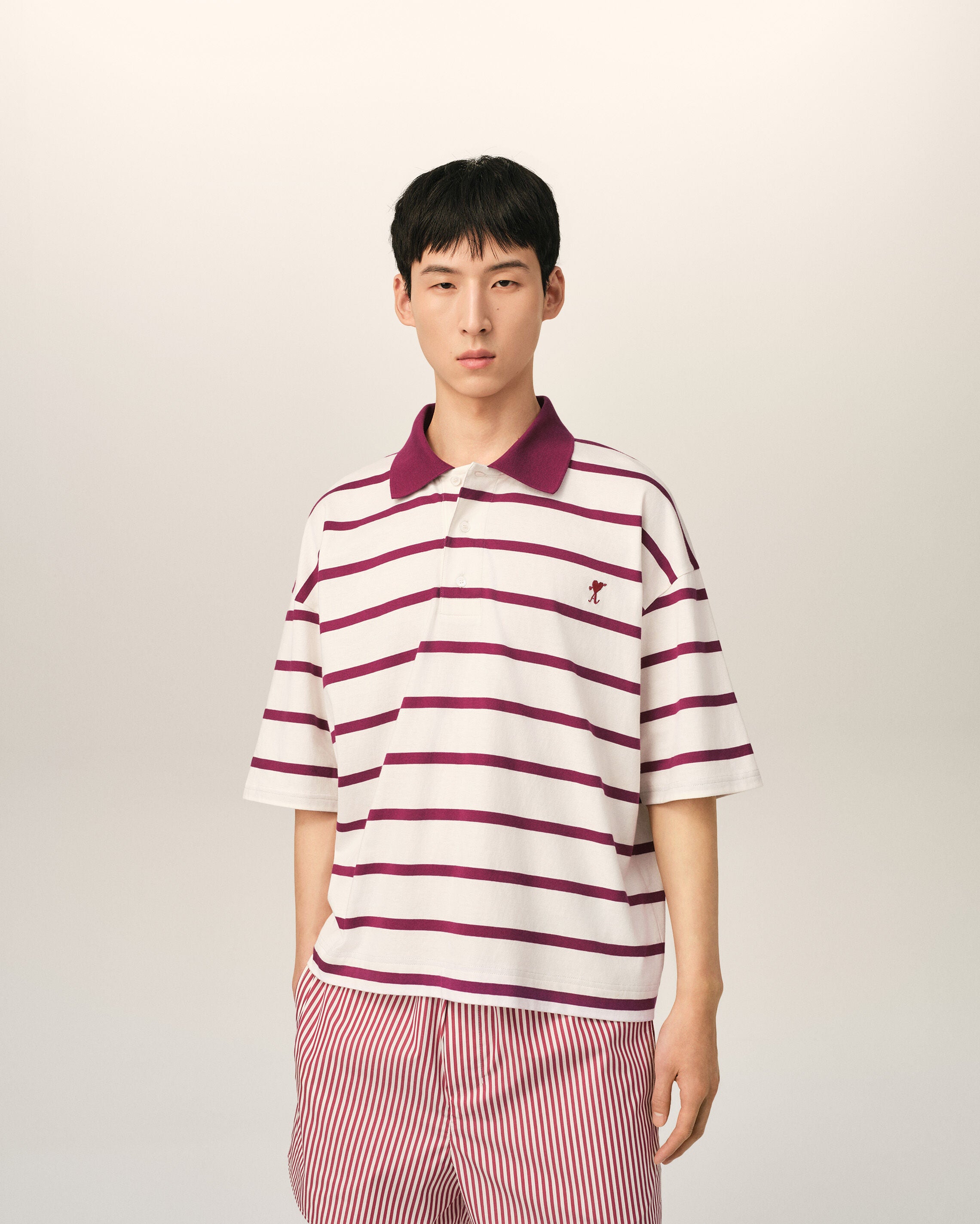 White cotton polo with heart arrow