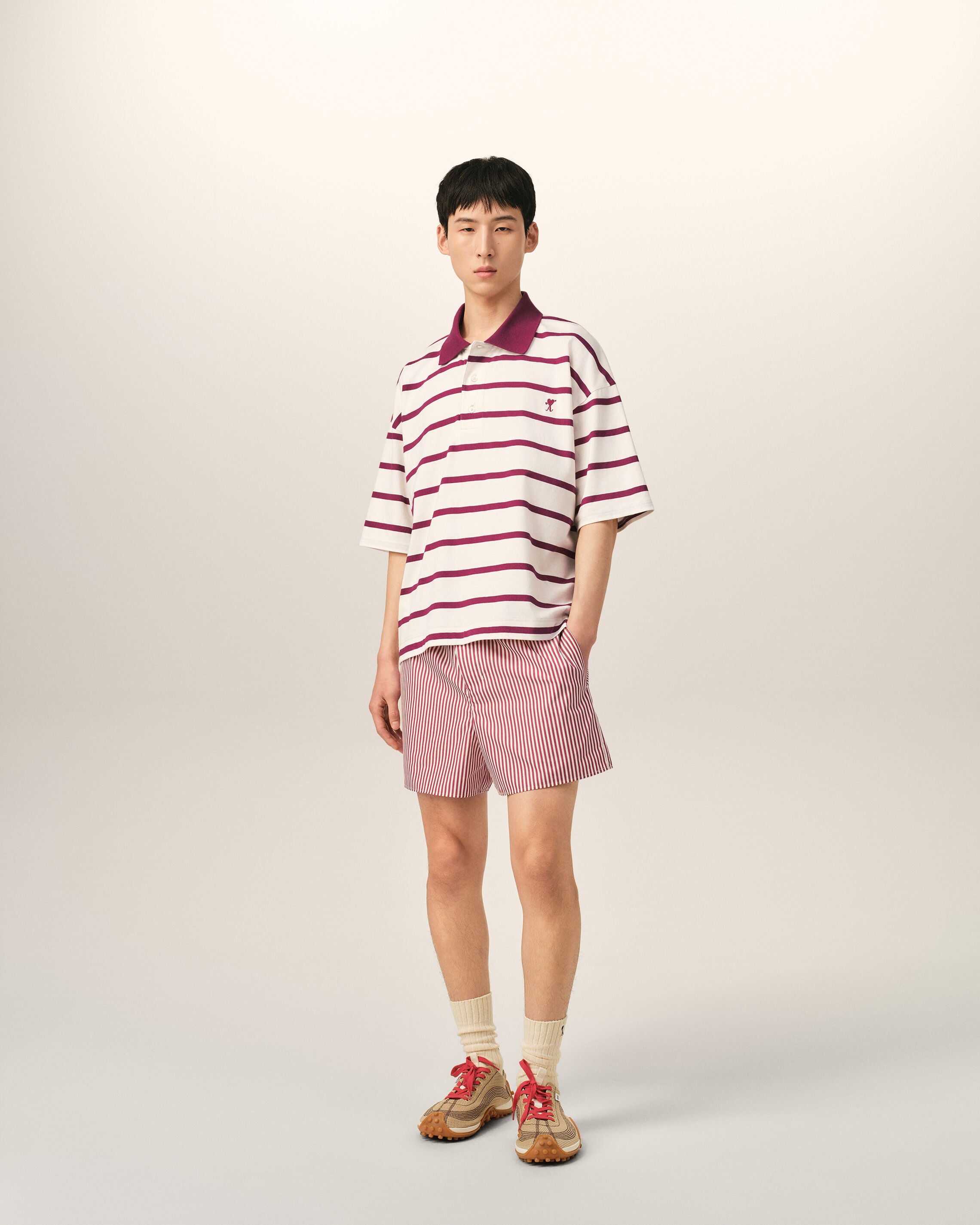White cotton polo with heart arrow