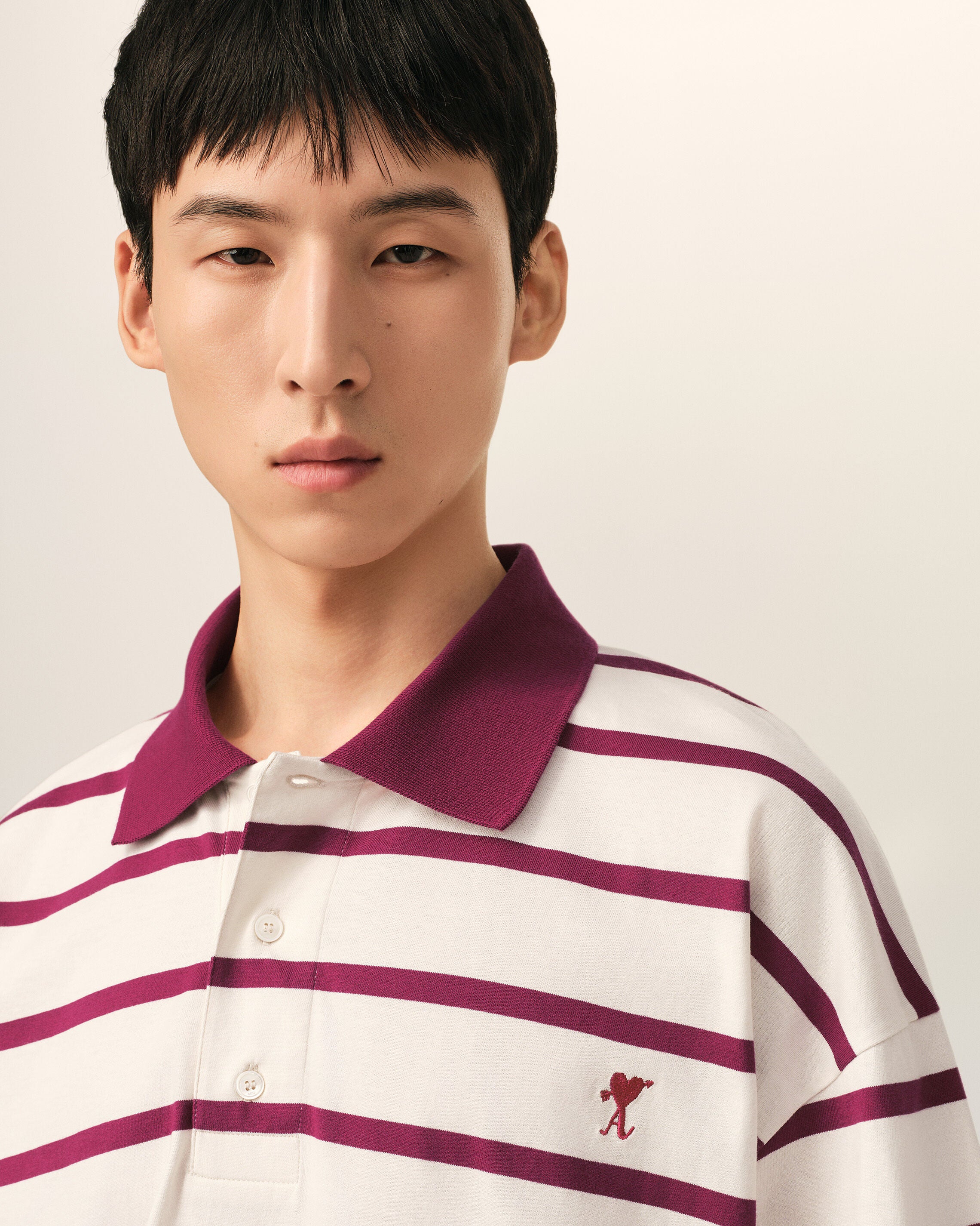 White cotton polo with heart arrow