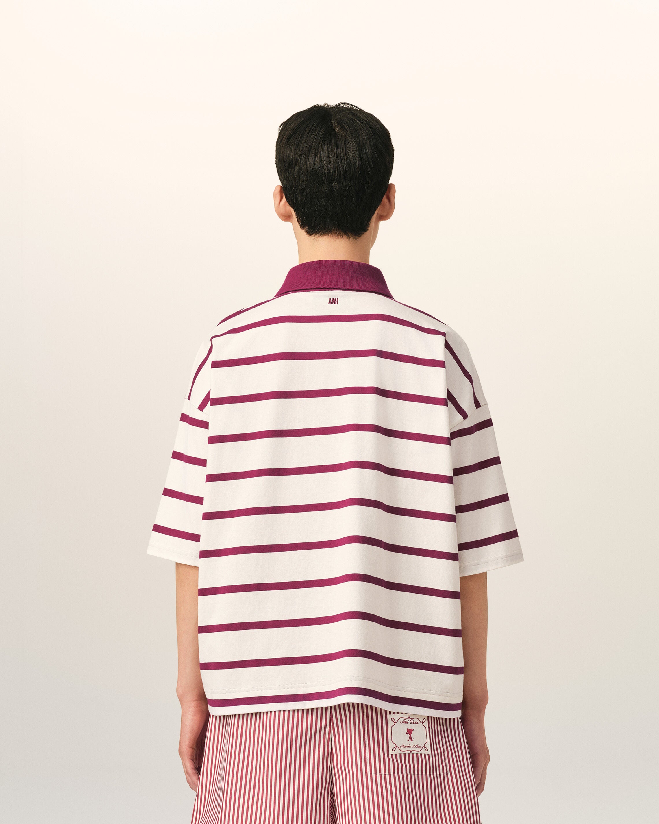 White cotton polo with heart arrow