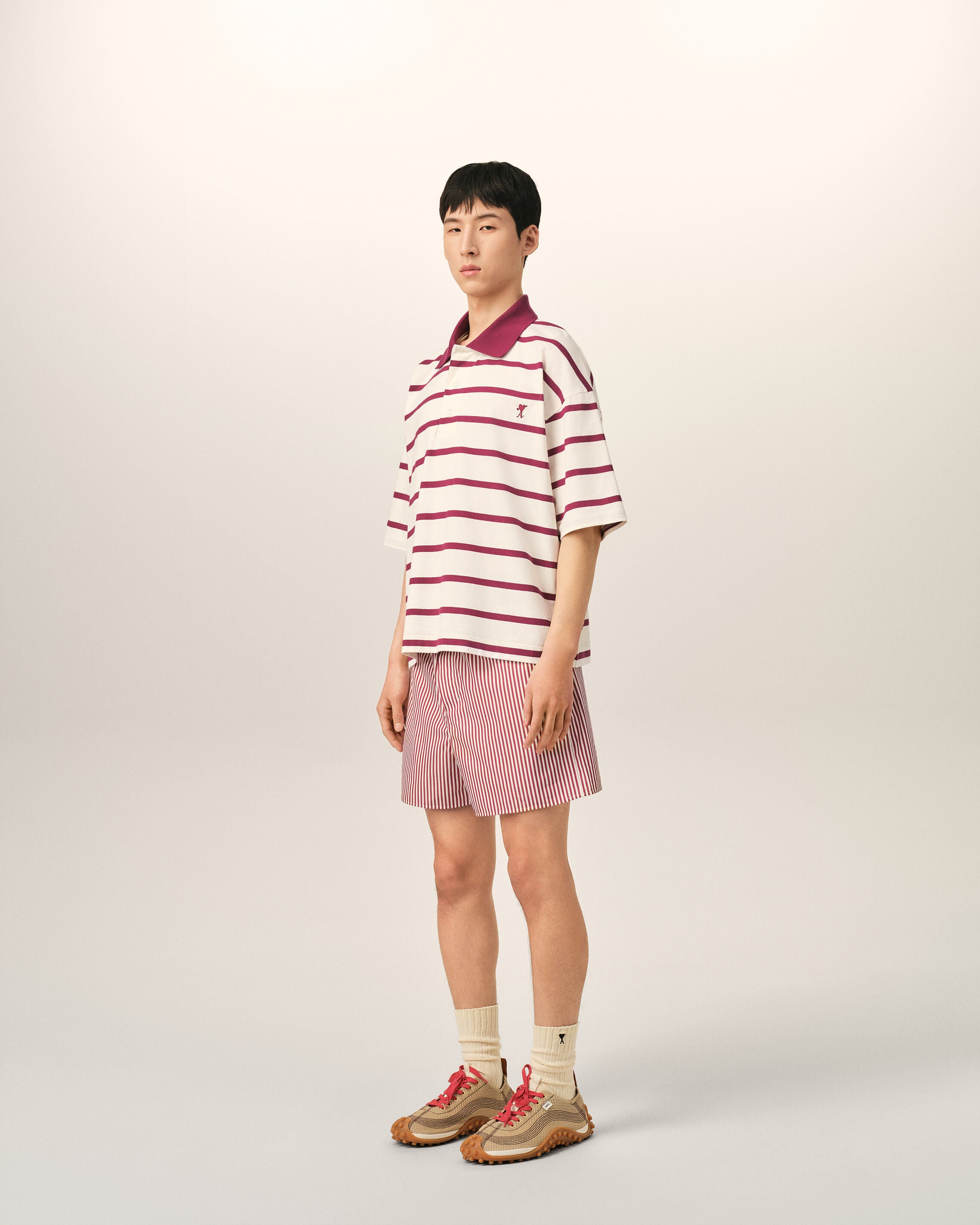 White cotton polo with heart arrow
