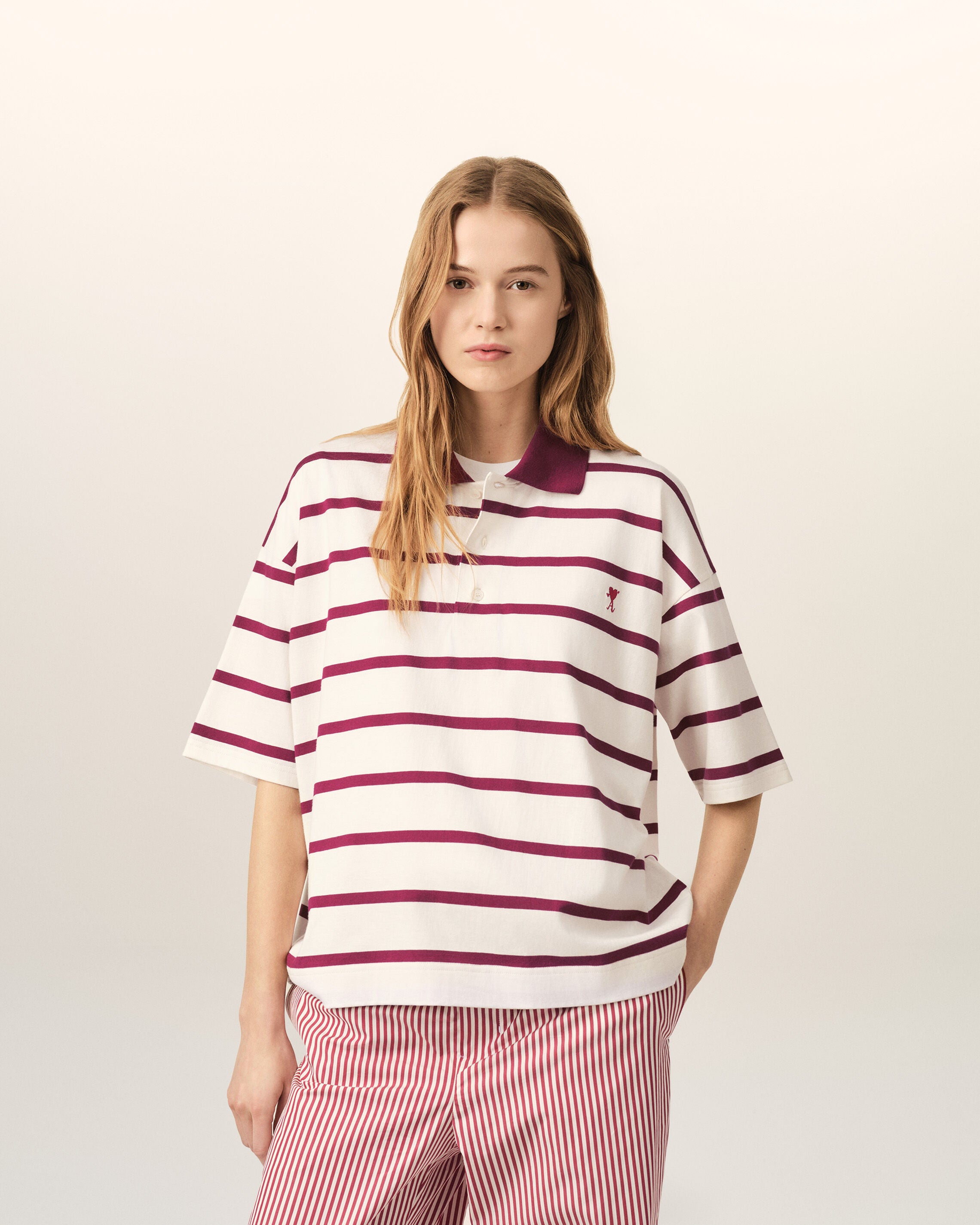 White cotton polo with heart arrow